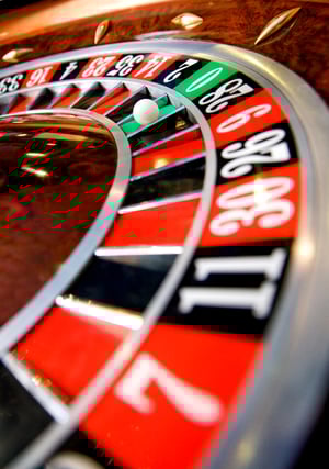 casino roulette close up with the ball on number zero